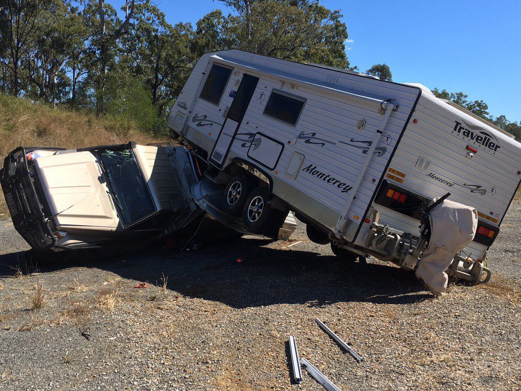 4WD and caravan rollover on Bruce Hwy.Photo Seven News Wide Bay